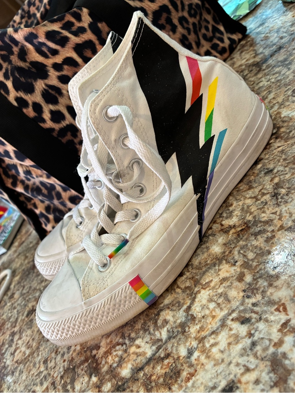 White High-Top converse Sneakers with Rainbow Lightning Accent